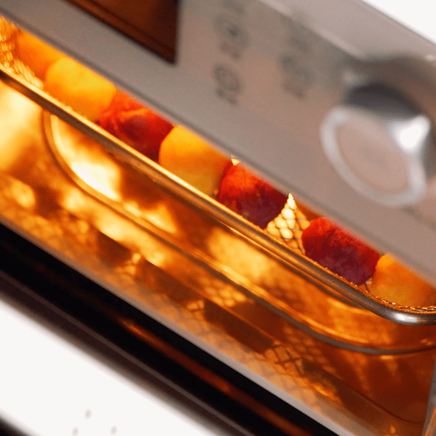 Lumo use oven to baked sweet potato balls cooking in tray with golden crispy texture